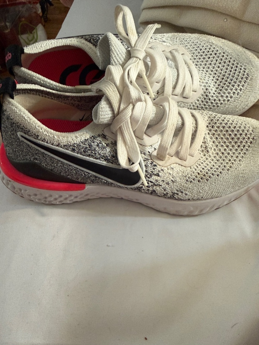 Nike White Knit Running Shoes with Black Swoosh and Pink Accents